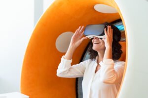 Happy businesswoman watching virtual presentation